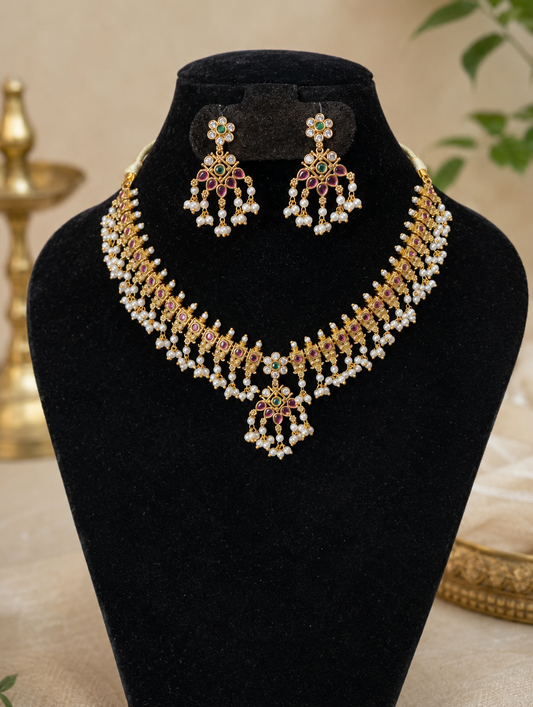 Jewelry set with necklace and earrings on a black stand