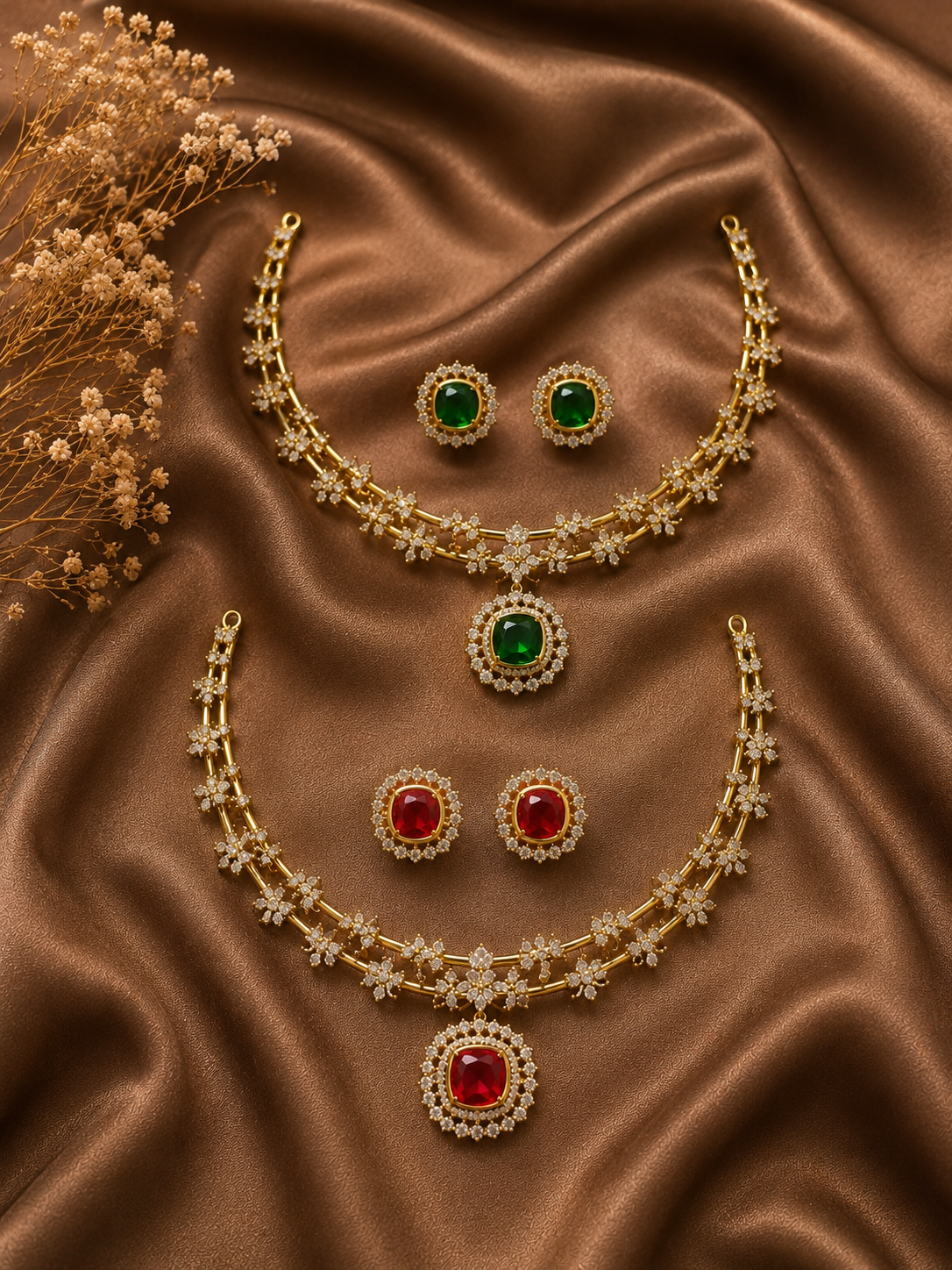 Jewelry set with necklaces and earrings on a brown satin background