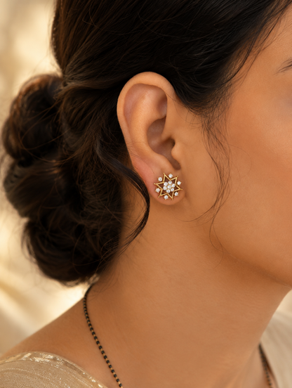 Elevate your jewelry collection with these exquisite 2-in-1 convertible ear jackets, designed to offer seamless transitions from daytime elegance to evening glamour. At the center of this versatile design are brilliant, starburst-shaped studs intricately encrusted with high-quality diamond replicas that radiate celestial charm. For a more dramatic, statement-making look, the studs seamlessly pair with detachable crescent-shaped ear jackets that feature five delicate, cascading pavé droplets designed to hug 