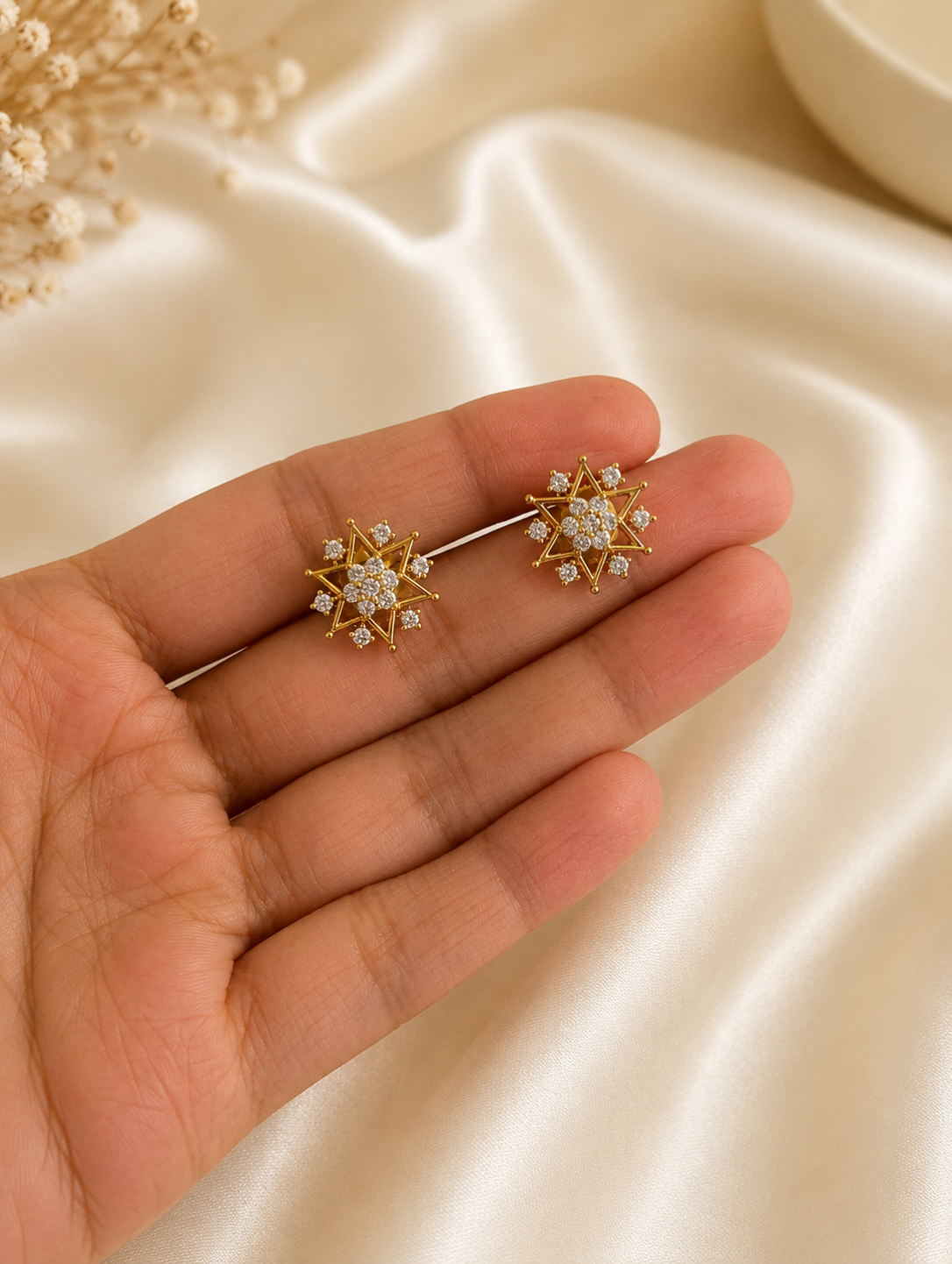 Elevate your jewelry collection with these exquisite 2-in-1 convertible ear jackets, designed to offer seamless transitions from daytime elegance to evening glamour. At the center of this versatile design are brilliant, starburst-shaped studs intricately encrusted with high-quality diamond replicas that radiate celestial charm. For a more dramatic, statement-making look, the studs seamlessly pair with detachable crescent-shaped ear jackets that feature five delicate, cascading pavé droplets designed to hug 