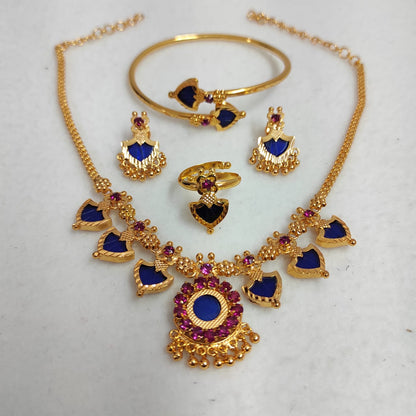 Gold jewelry set with blue and purple stones on a white background