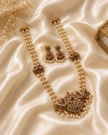 Jewelry set with necklace and earrings on a satin surface