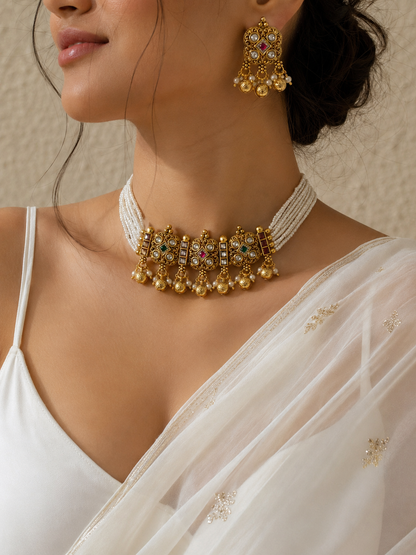 Modern Indian bridal antique gold and pearl choker necklace set with detailed Kundan craftsmanship for elegant festive, wedding, or bridesmaid styling.