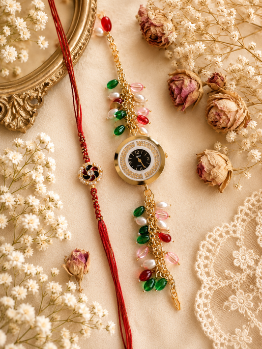 Handcrafted Bhaiya Bhabhi Rakhi set featuring a gold-toned watch-style Lumba bracelet accented with green, red, pink, and white beads beside a red thread Rakhi.