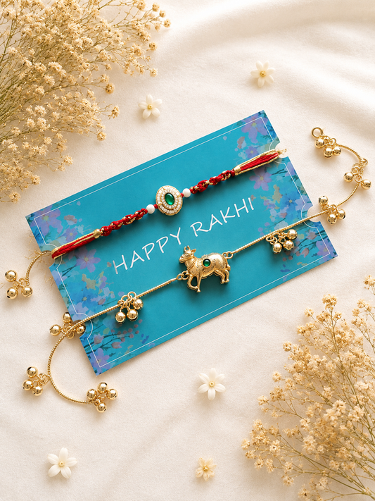 Handcrafted Bhaiya Bhabhi Rakhi set featuring a gold-toned Lumba bracelet with a cow center charm and hanging small bells next to a matching oval thread Rakhi.